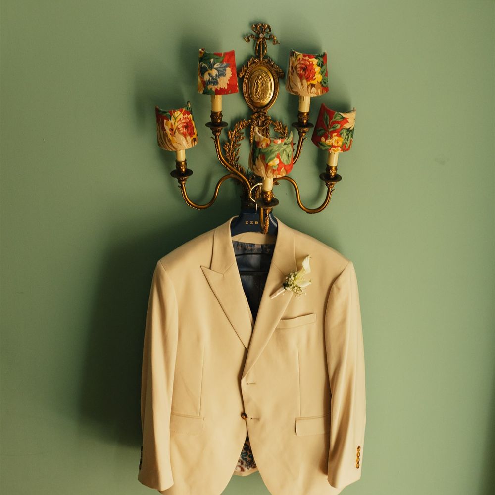 grooms suit with lily boutinniere