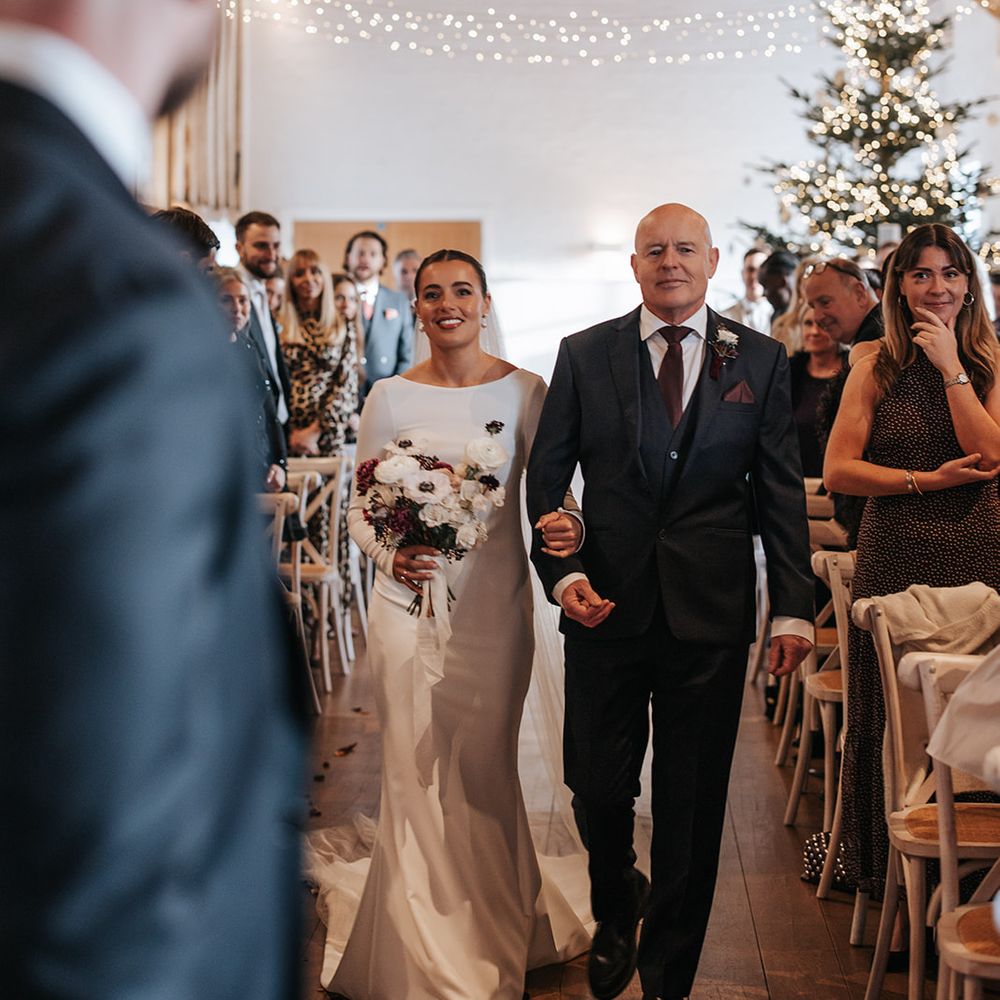 bride walked down the aisle with father winter wedding