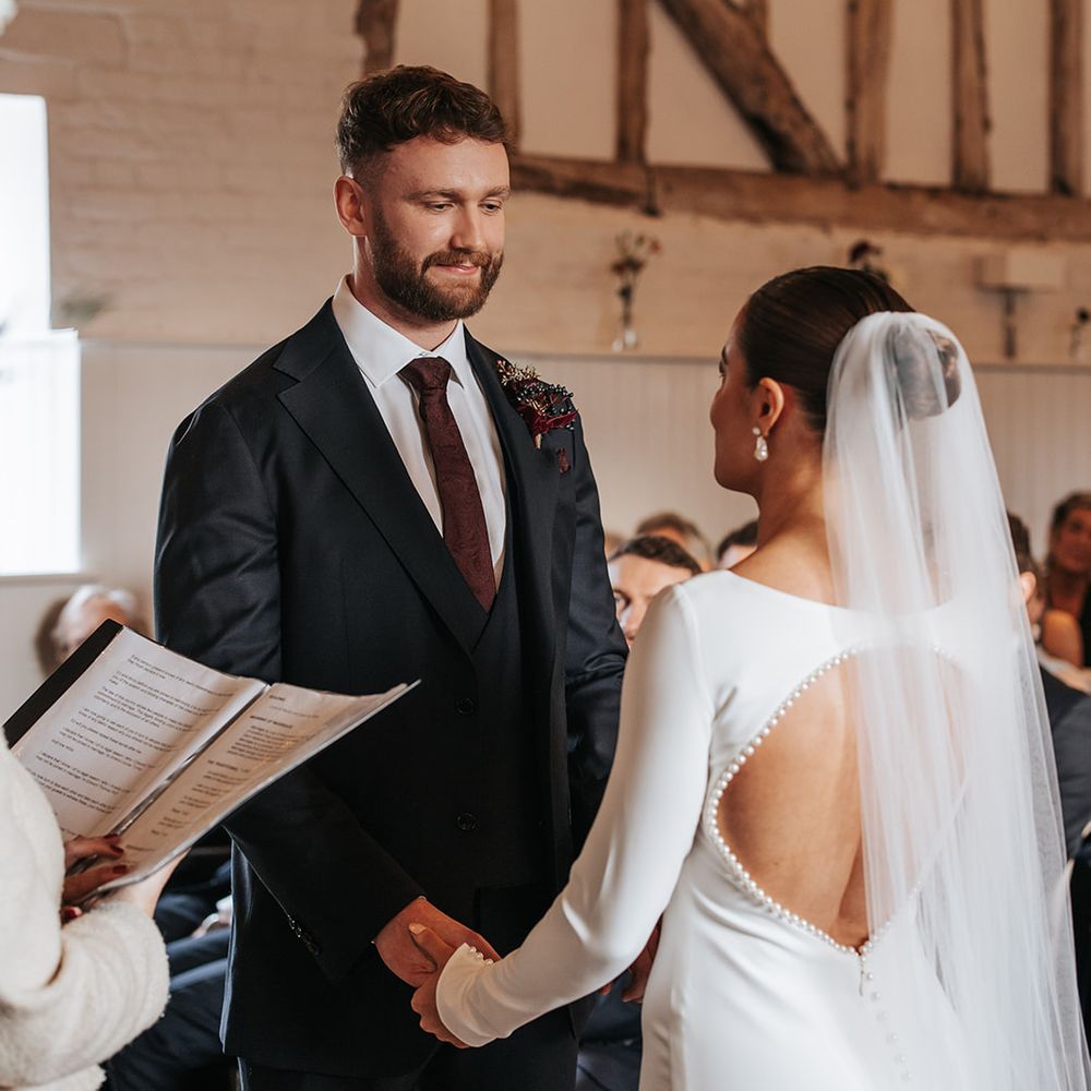 burgundy tie and boutonniere open back wedding dress