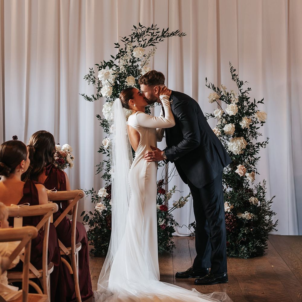 couples first kiss married winter wedding