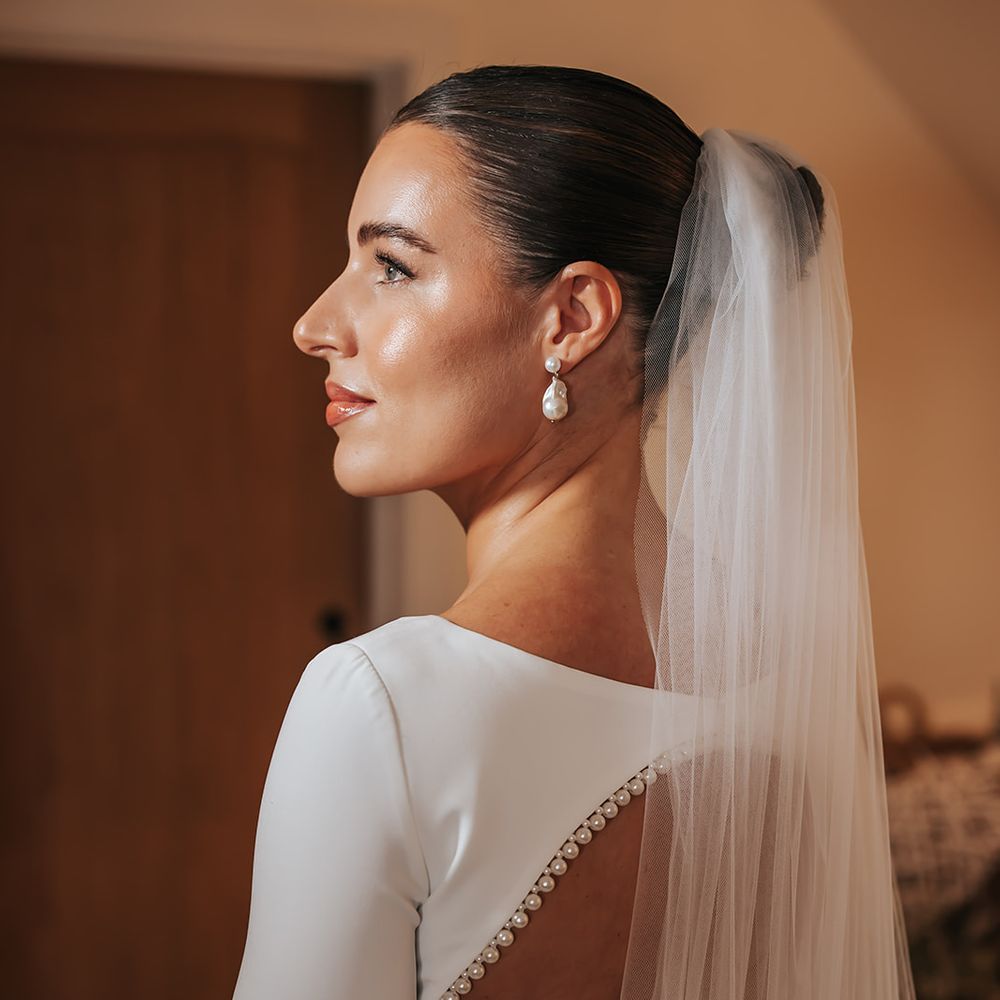 long sleeve pearl open back wedding dress