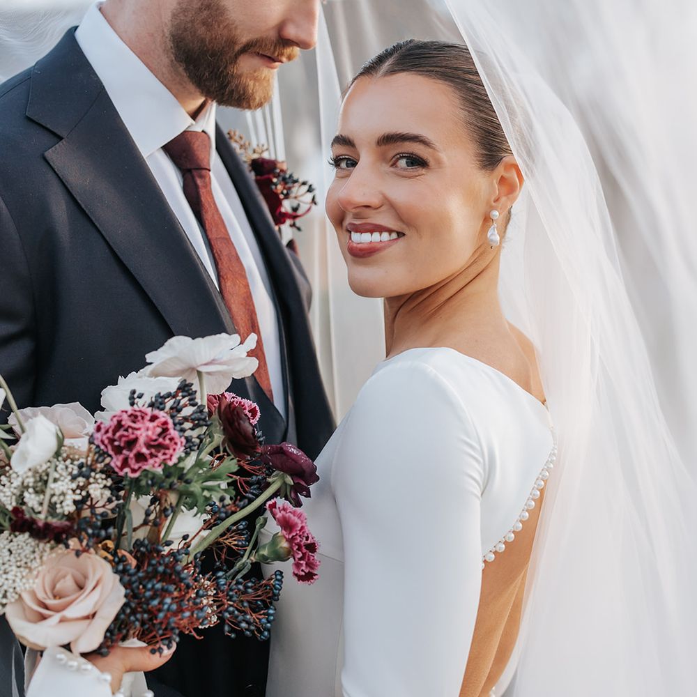 married couple white burgundy winter bouquet