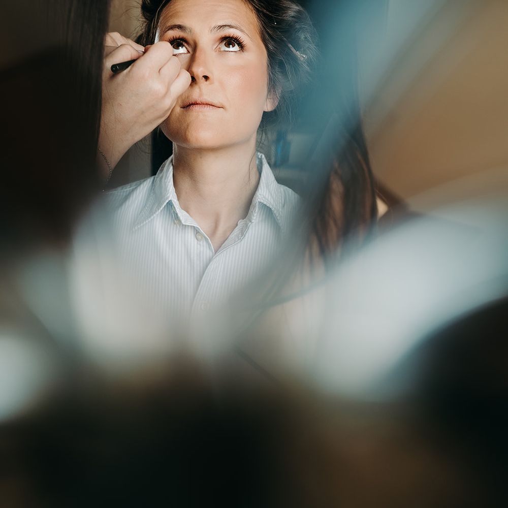 bride getting ready in reflection