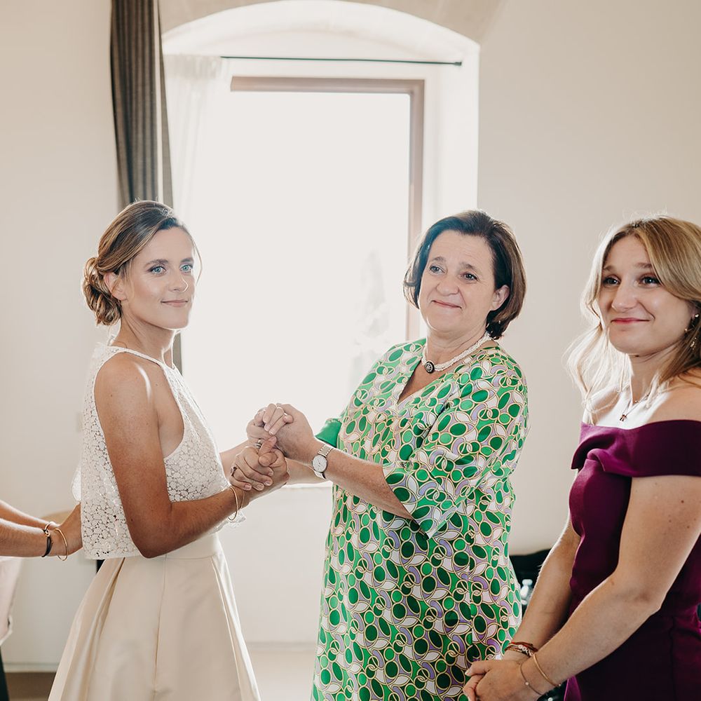 bride smiling whilst getting ready