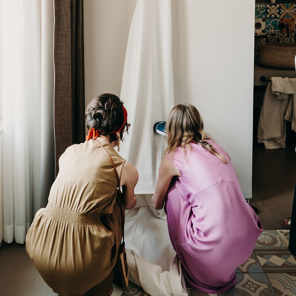 halter neck wedding dress being steamed
