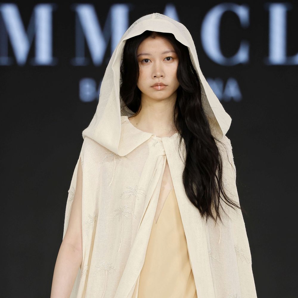 Immaclé bridal hooded cape with sheer fabric and minimalist gown on the runway at Barcelona Bridal Fashion Week 2026