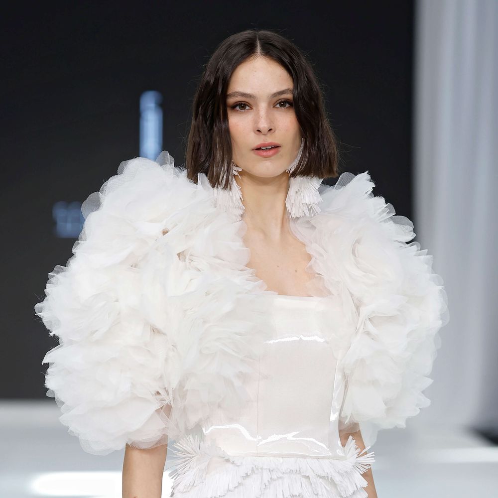 Serina short wedding dress with structured bodice and oversized ruffle sleeves at Barcelona Bridal Fashion Week 2026