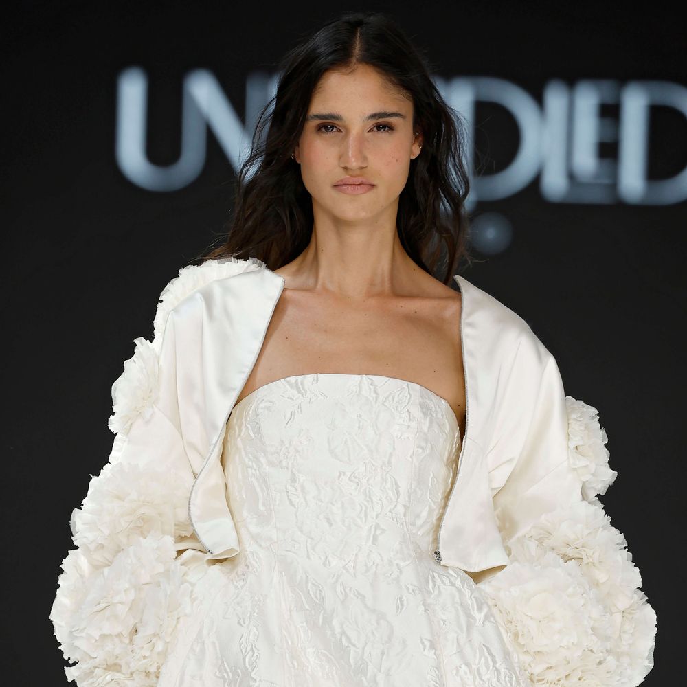 Unbridled Studio strapless wedding dress with cropped jacket and floral statement sleeves at Barcelona Bridal Fashion Week 2026