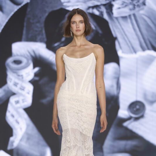 Yolancris lace mermaid wedding dress with lingerie-inspired detailing on the runway at Barcelona Bridal Fashion Week 2026