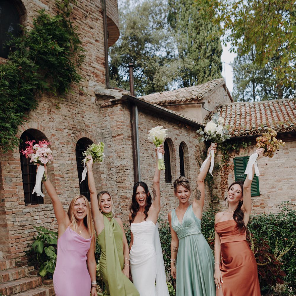 bride bridesmaids colourful satin dresses sage terracotta bouquets