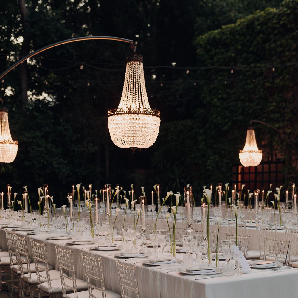 evening reception table chandeliers candlelight calla lilies