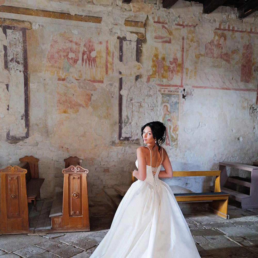 bride satin ballgown cathedral train chapel fresco walls