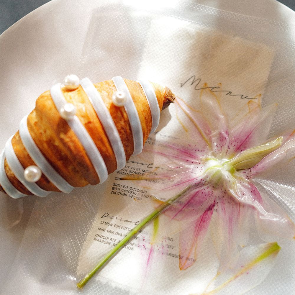 fashion forward wedding breakfast croissant pearl details