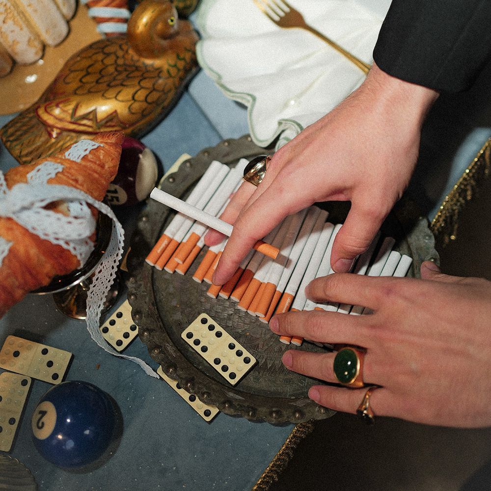 groom detail cigarettes dominoes editorial wedding