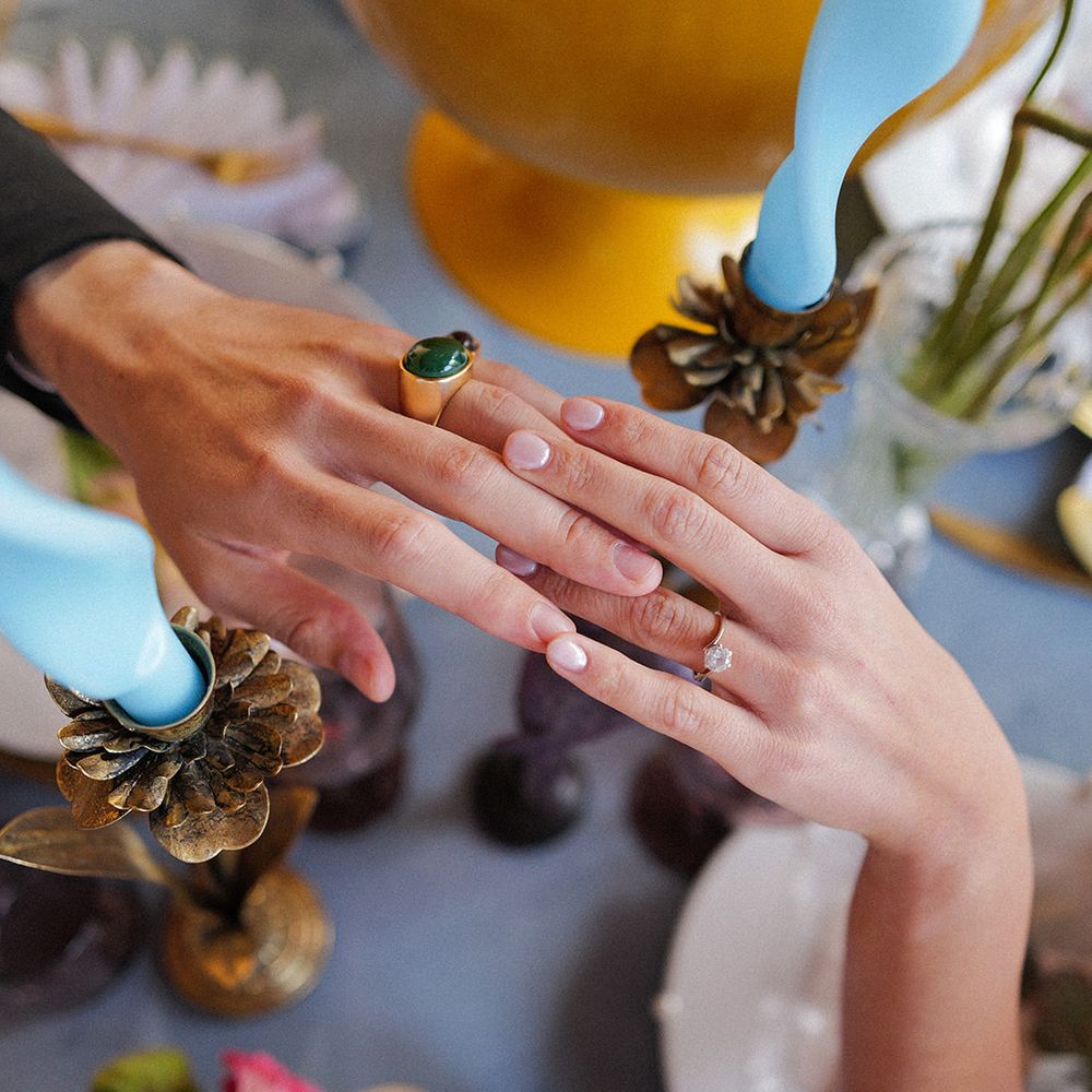 wedding ring exchange close uo colourful tablescape