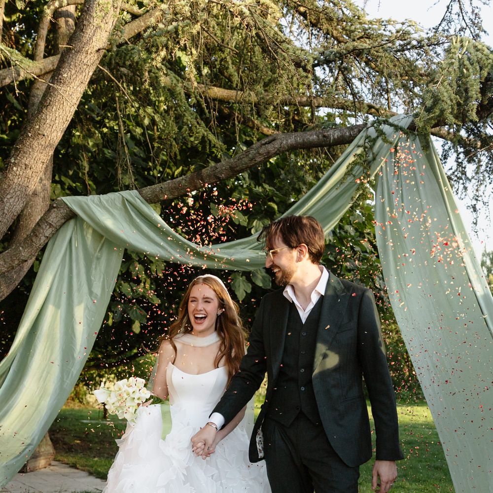 confetti walk married couple french gardens
