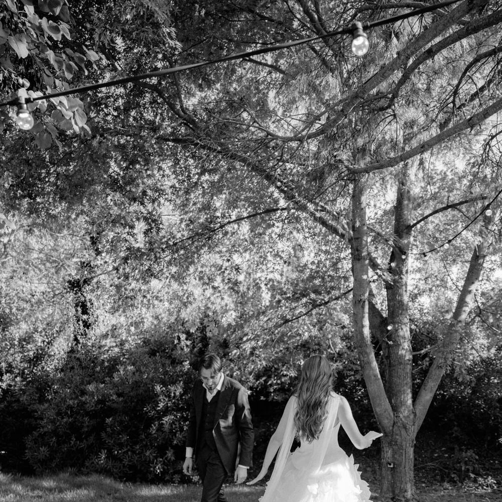 couple first look ruffle tulle wedding gown