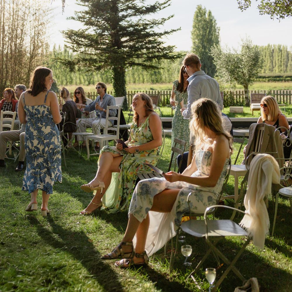 summer outdoor intimate wedding ceremony guests sitting 