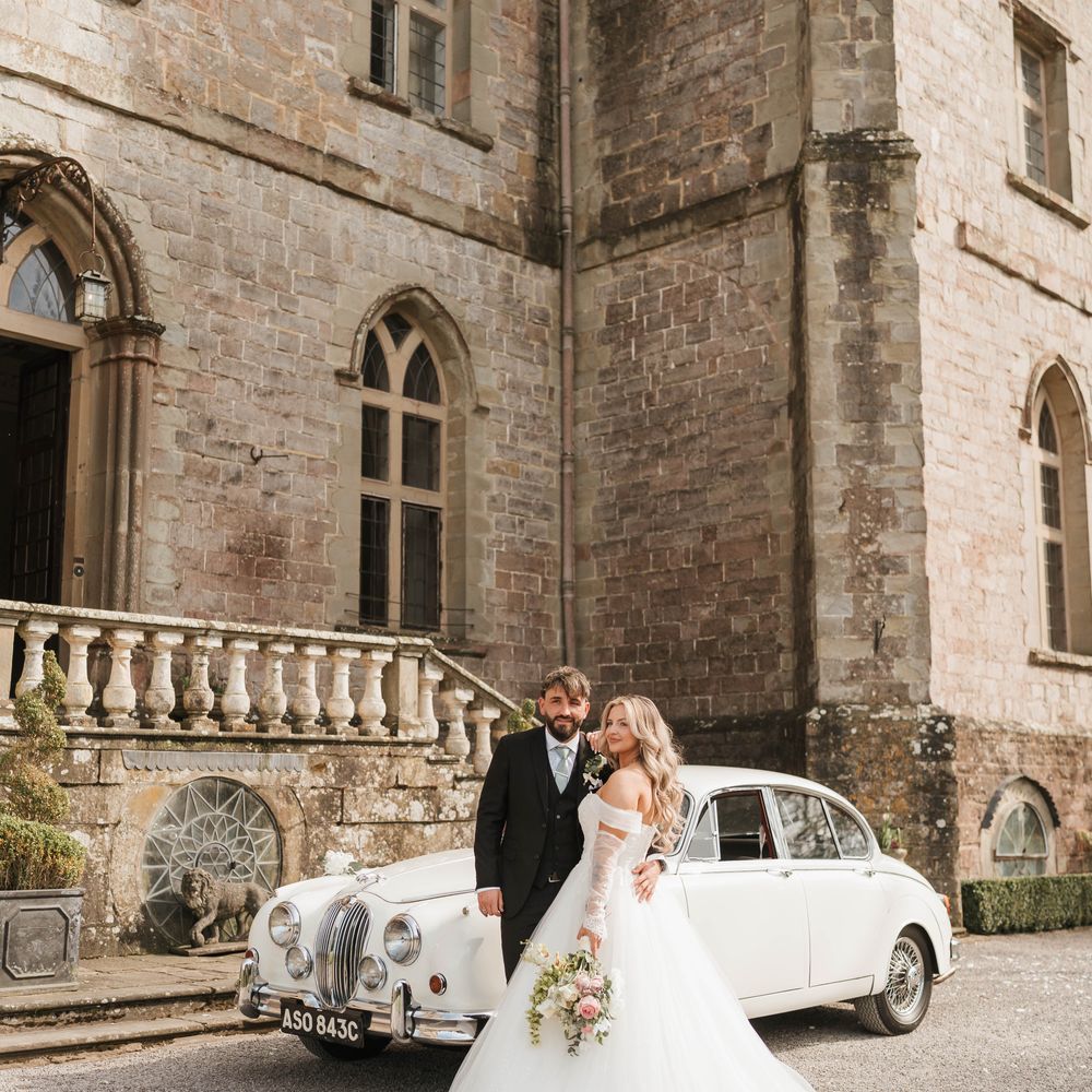 bridal gown sweeping train vintage car castle wedding