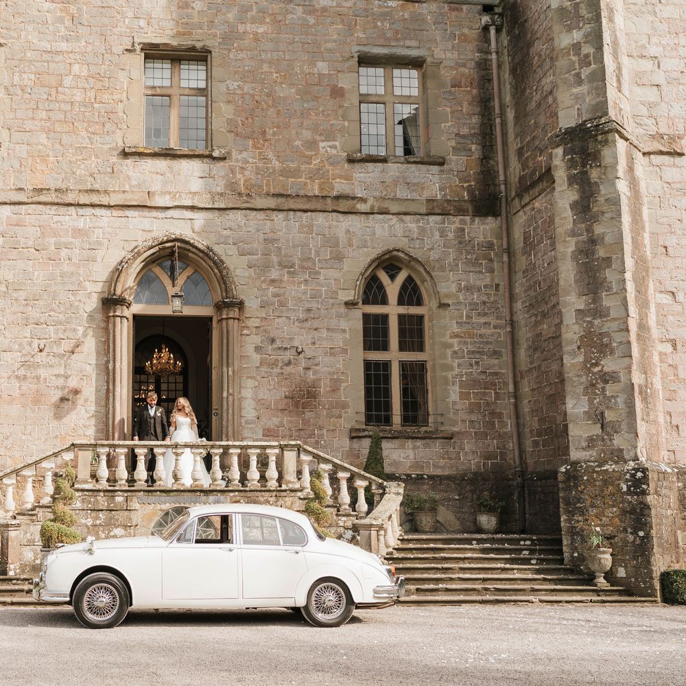 white vintage wedding car clearwell castle