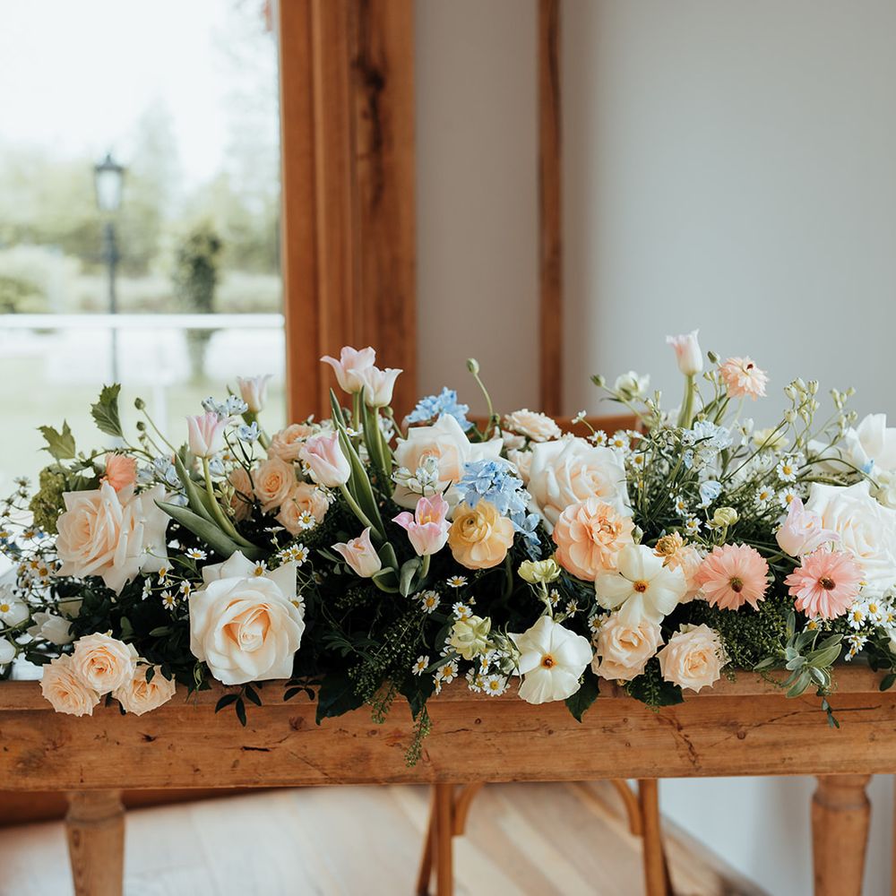 floral display pastel peach blue roses bouquet