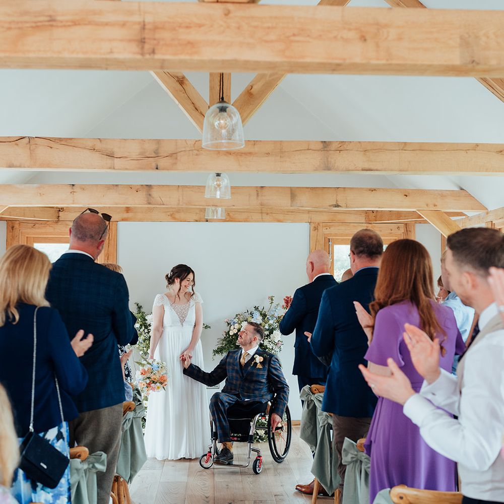 guests clap married couple