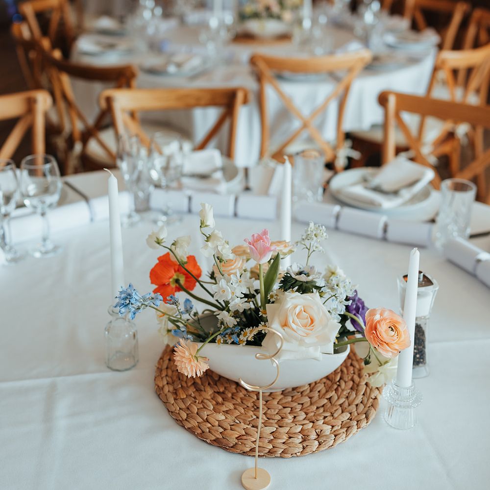 multi coloured pastel floral centre pieces wooden accents