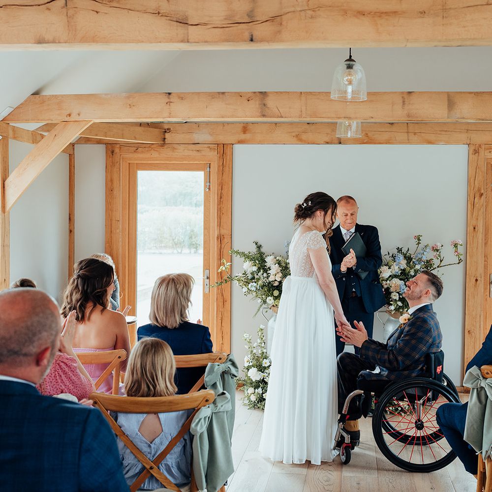 wedding ceremony wooden beams pastel decor