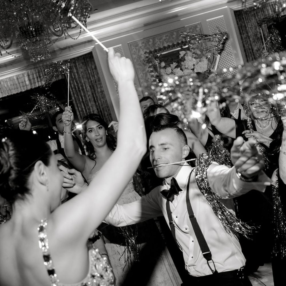 bride groom dancing silver tinsel celebration