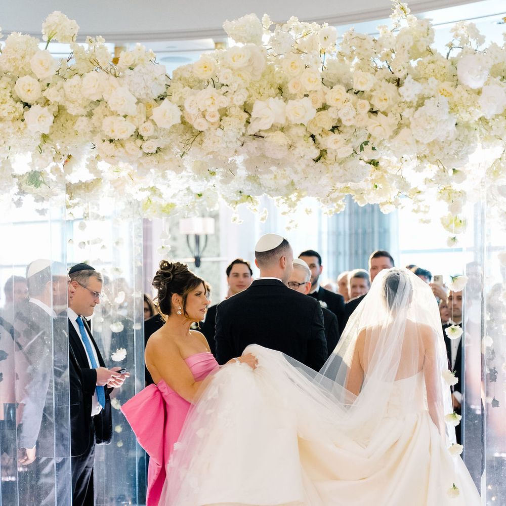 bride groom in glass floral altar