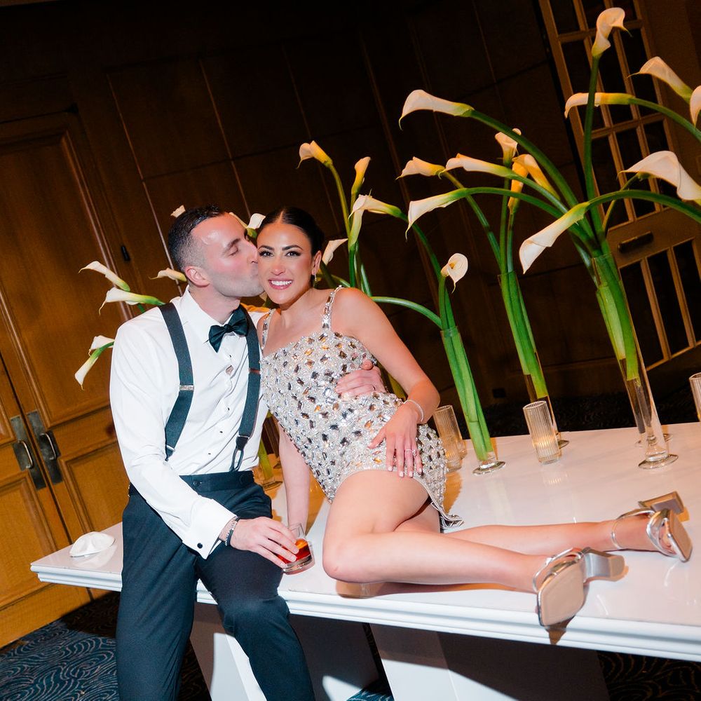 married couple bride mini dress change calla lilies