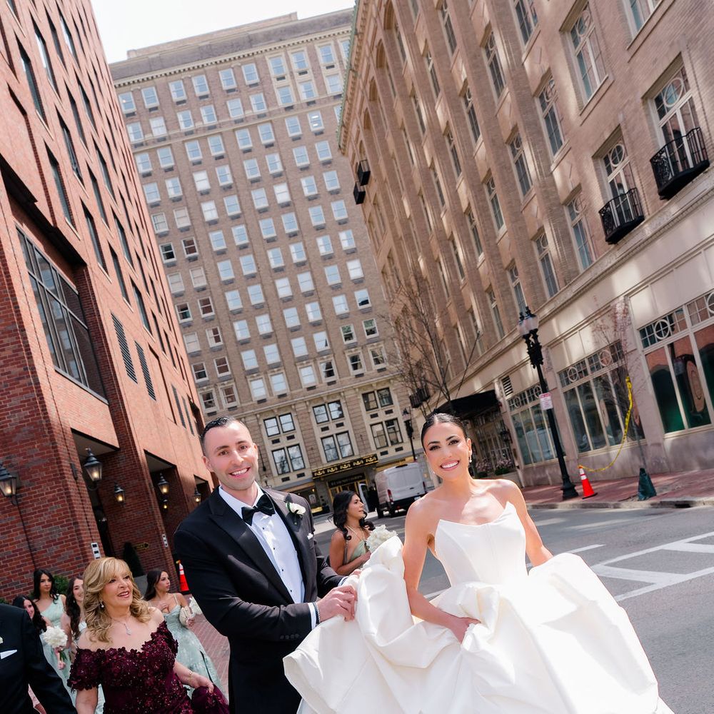 married couple running through streets