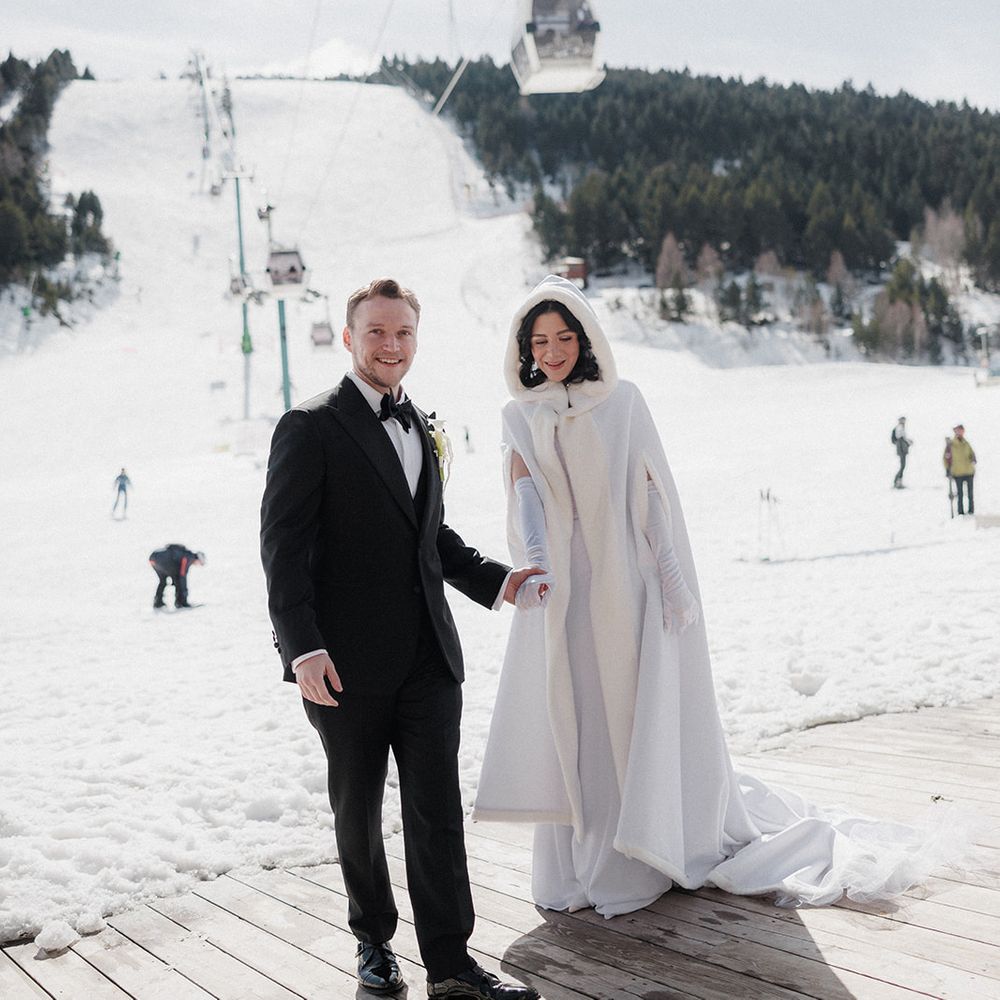luxury ski resort wedding couple snowy mountain backdrop