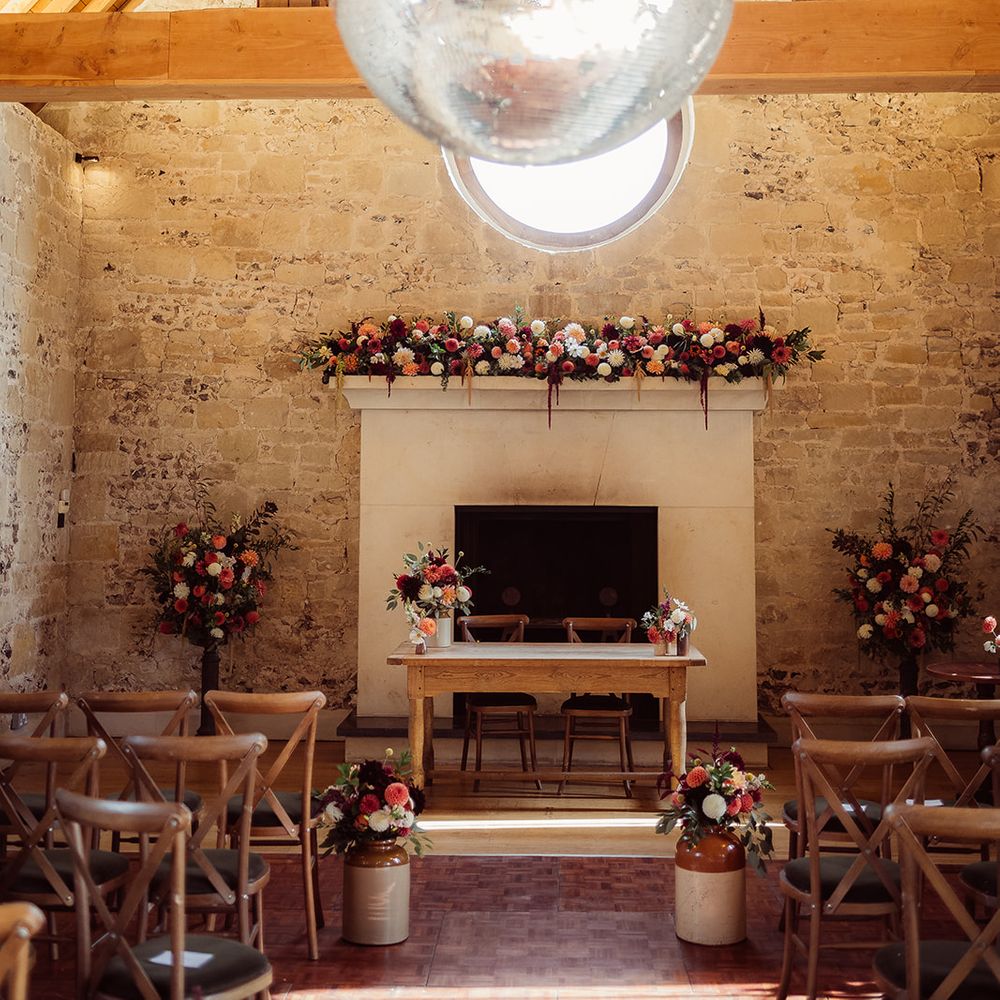 disco ball orange white flower decor reception room