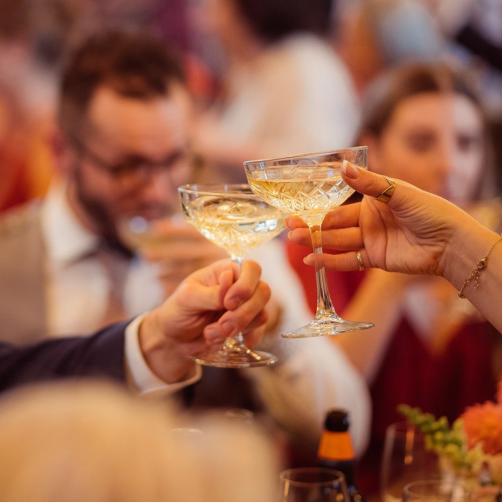 guests cheers champagne cocktails