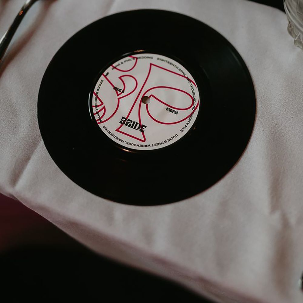 Fun and unique wedding place name idea with vinyl record