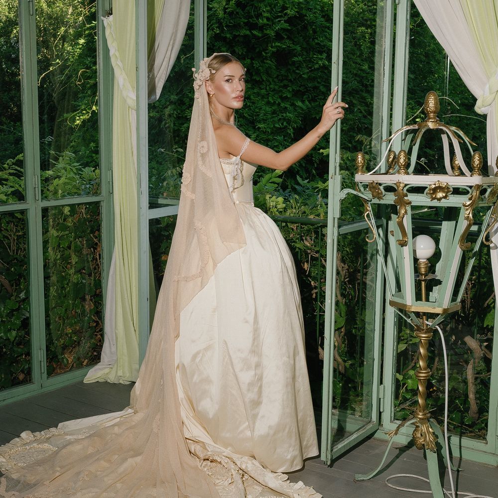 castle green gardens bride couture gown looking out window
