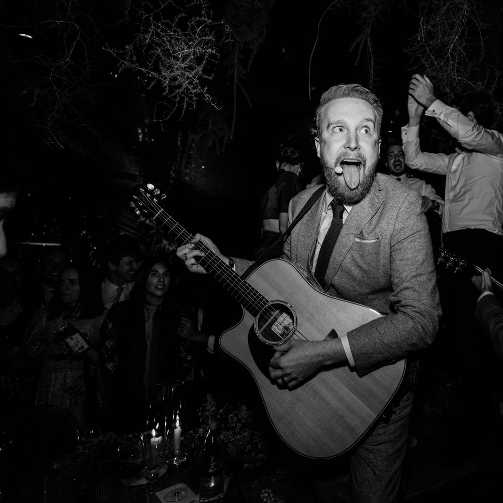 wedding entertainment guitarist sticking out tongue