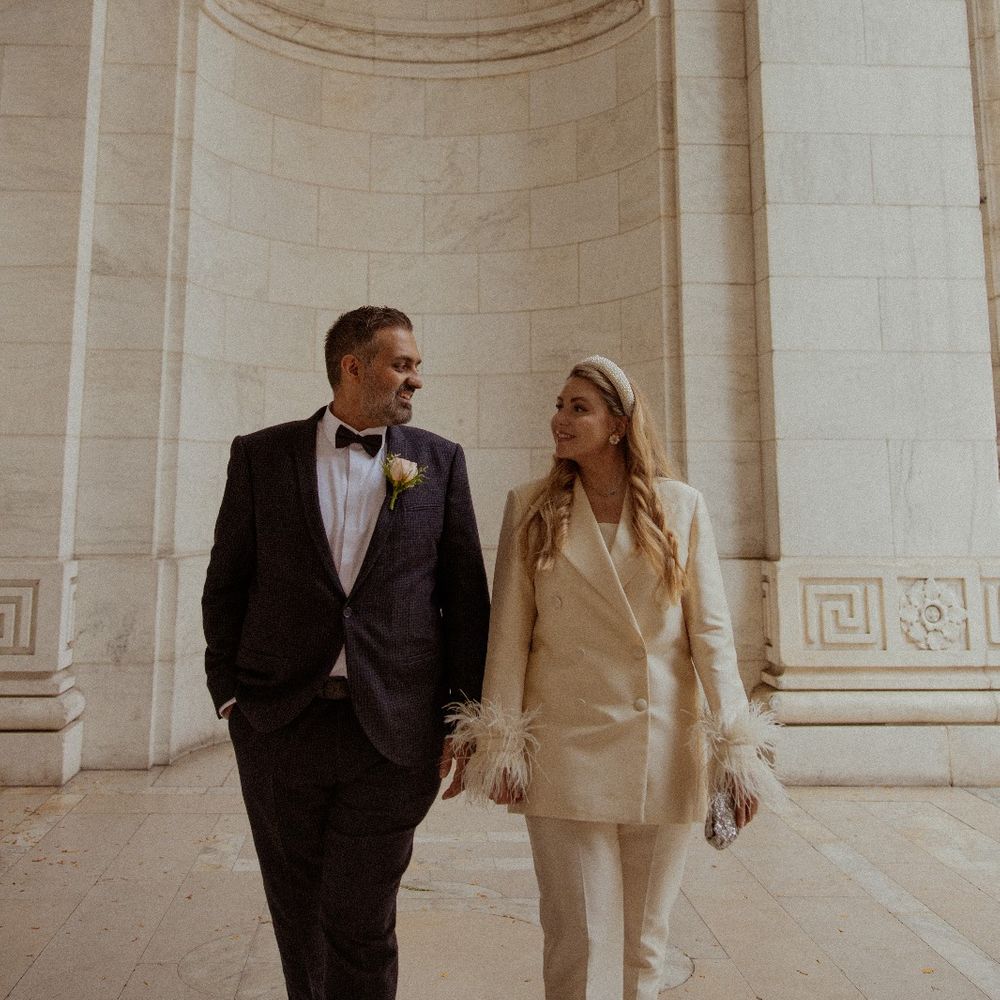 city intimate elopement bride and groom in suits