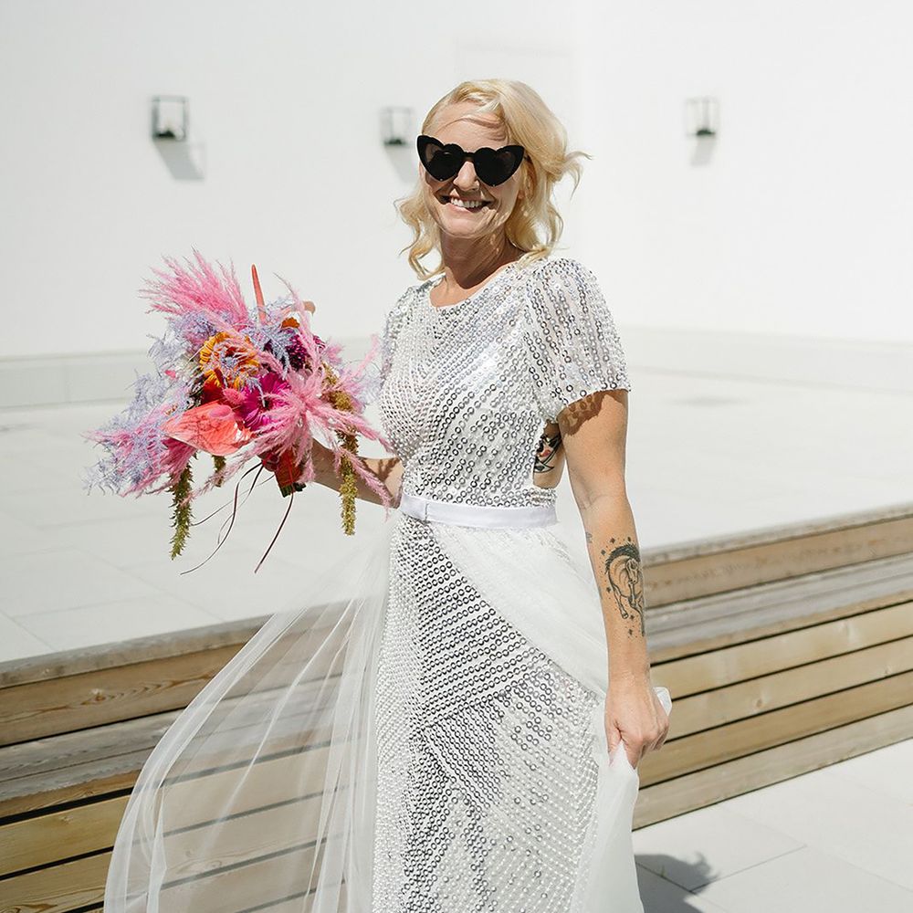 Mature bride with natural bridal makeup and silver sparkly dress