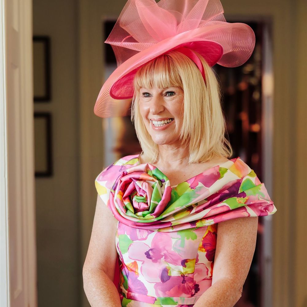 Mother of the bride with bright, glowy makeup