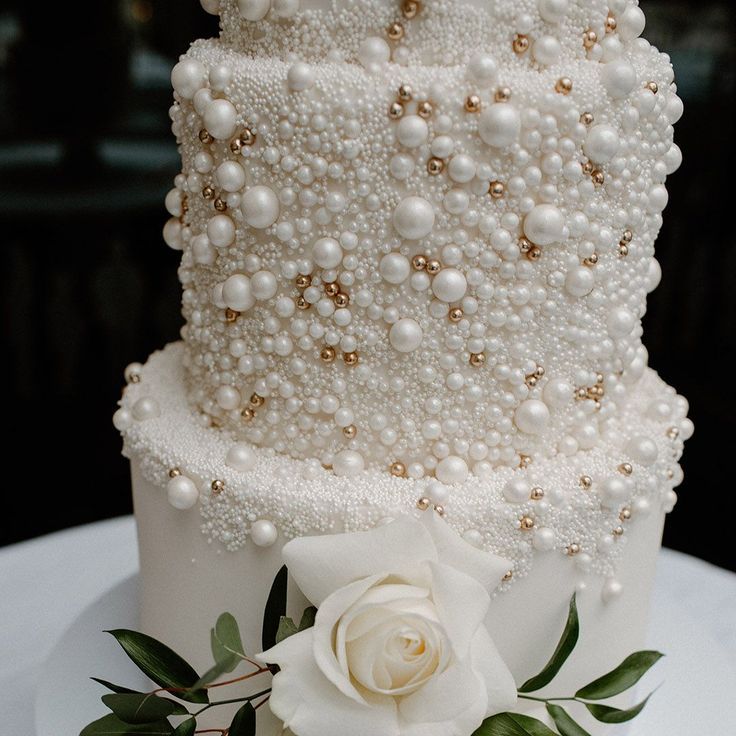 Four Tier White Iced Pearl Wedding Cake