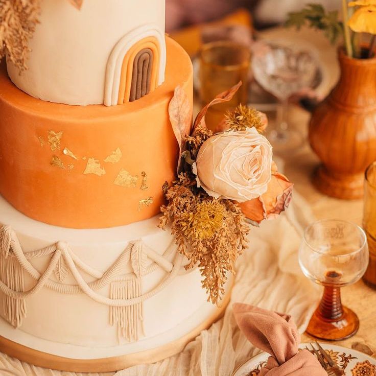 Three Tier Orange and White Wedding Cake