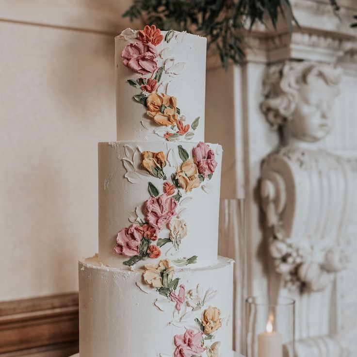 Three Tier White Iced Wedding Cake with Iced Flowers Trailing The Cake