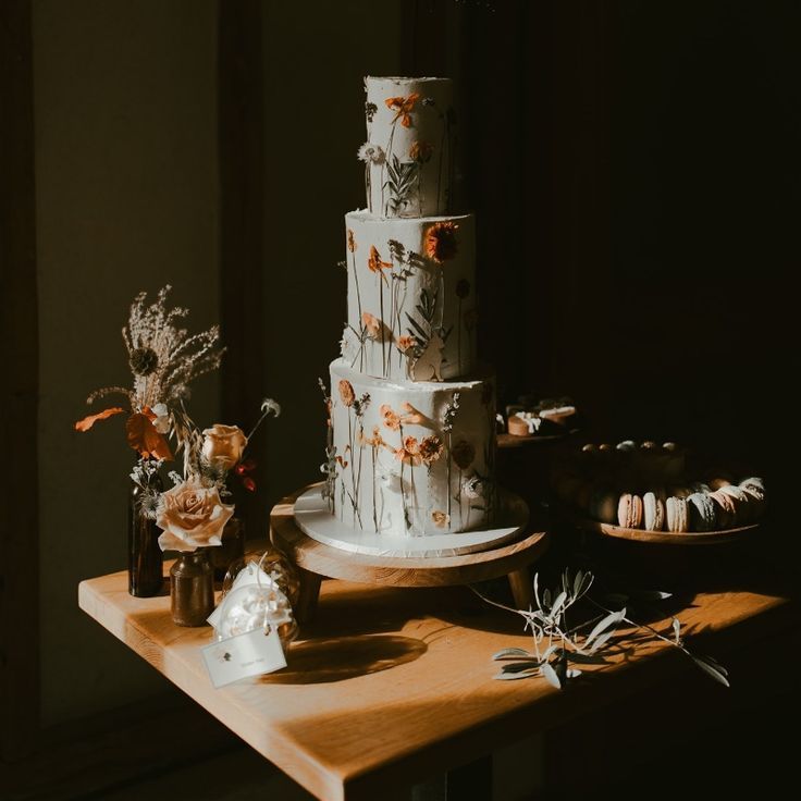 Three Tier White Iced Wildflower Wedding Cake