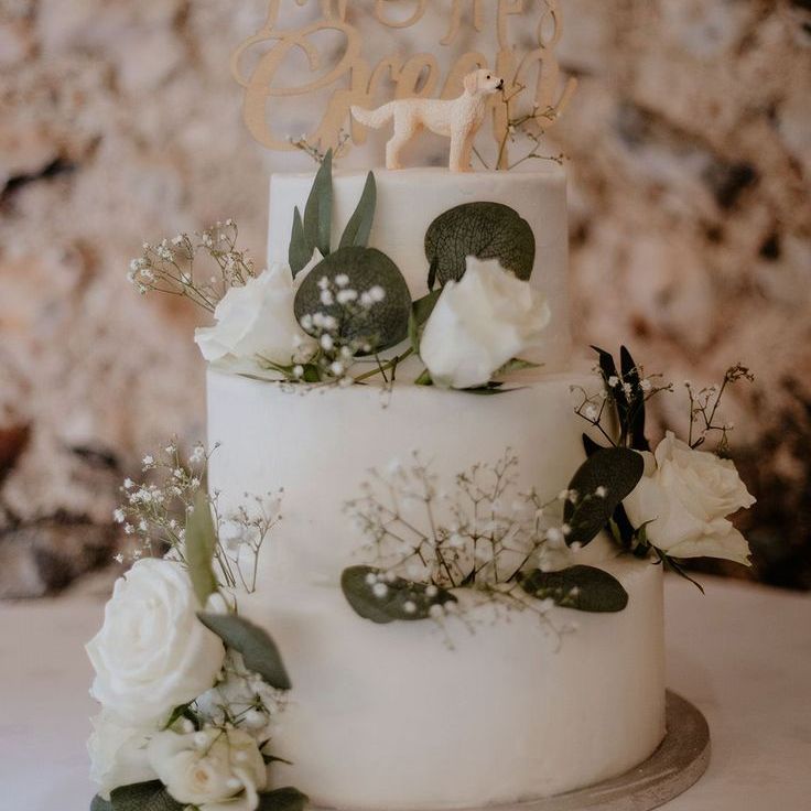 Three Tier White Wedding Cake with White Roses and Personal Cake Topper