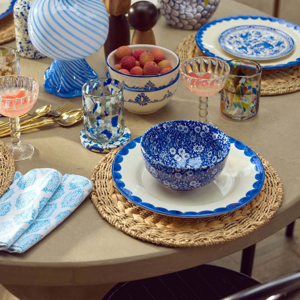 Blue tablescape with wicker place mats