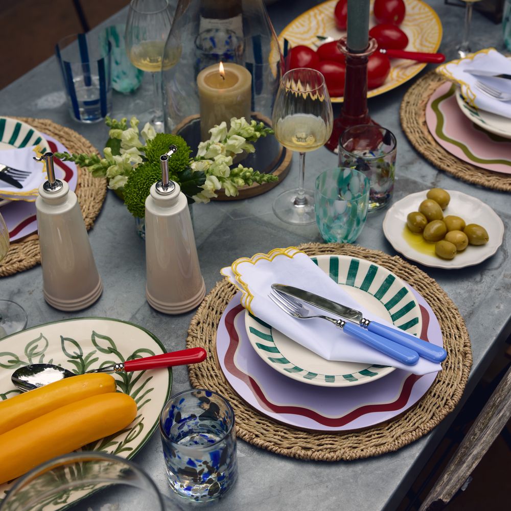 Modern wedding tablescape with colourful crockery 