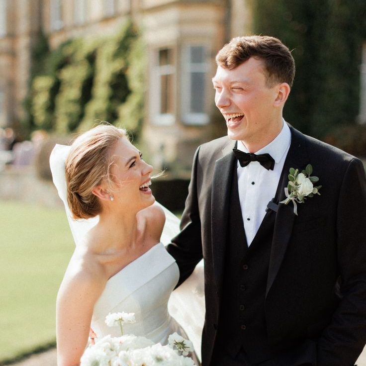 Beautiful Wedding Photo Capturing Smiling Bride & Groom at Country House British Wedding