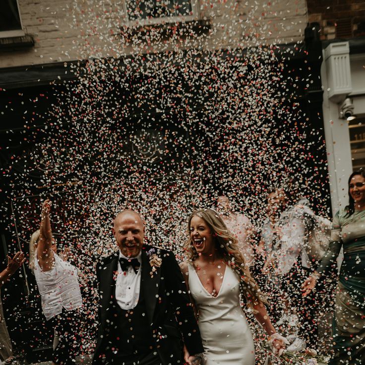 Epic Confetti Exit at London Elopement with Satin Wedding Dress
